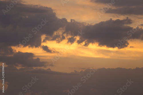 Beautiful sunset with clouds of orange and yellow in the ocean, the river