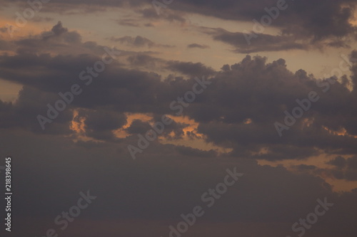 Beautiful sunset with clouds of orange and yellow in the ocean, the river