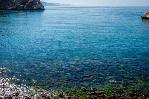 Jebha island and waves and rocks photo