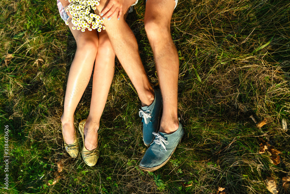 Summer top view of romantic man and woman lying on the field. The ...