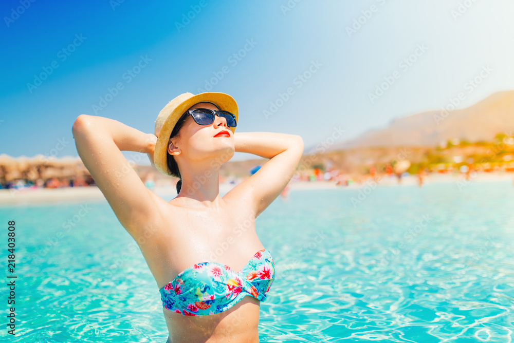 beautiful bikini  woman on beach, portrait of attractive woman sunbathing and smiling to the sun