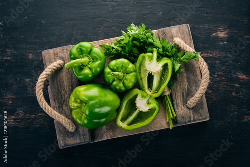 Slika na platnu Fresh green pepper in a wooden box