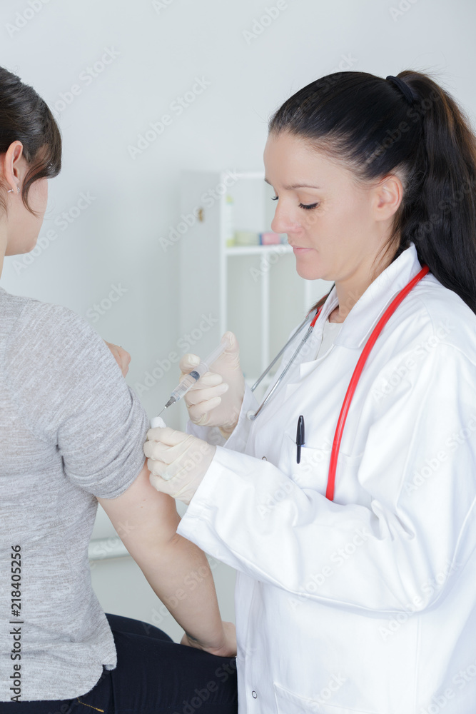 doctor injecting patients hand doctor injecting patients hand