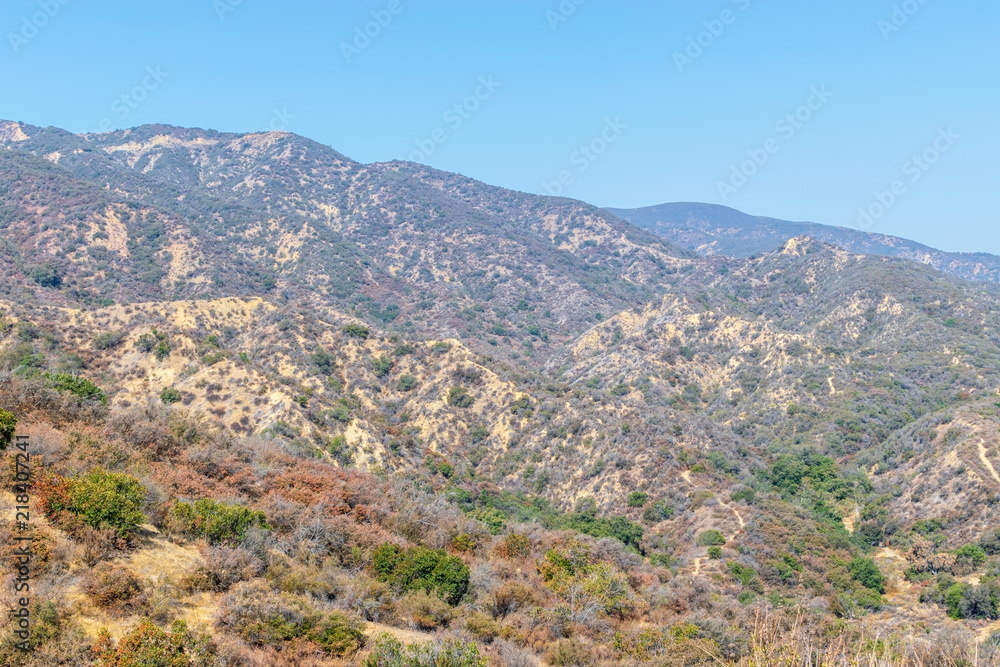 Extremely dry hills in California mountains on hot summer day with sky for copy space Extremely dry hills in California mountains on hot summer day with sky for copy space
