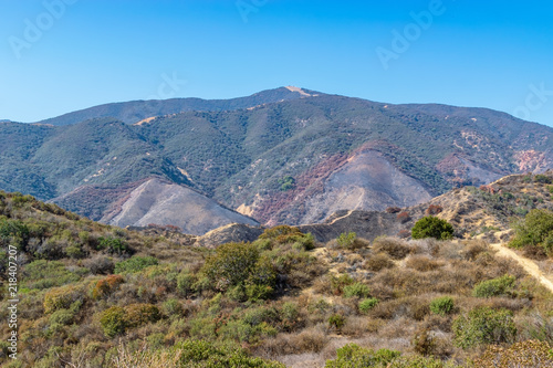 Forest fire damaged hills in middle or Southern California mountains popular for hiking and biking