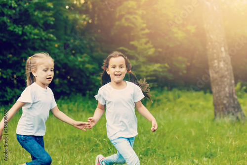 Happy children running around outside playing catch-up concept