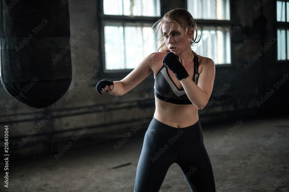 Female Boxer preparing for training in Boxing Club
