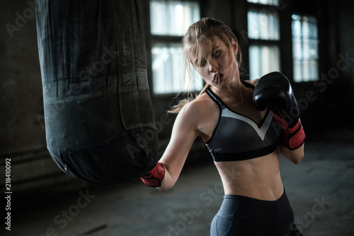 Female Boxer preparing for training in Boxing Club © Nejron Photo