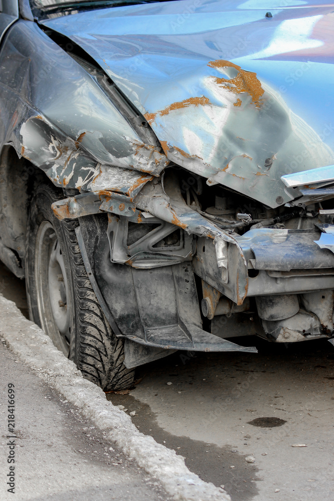 Closeup of a heavily damaged car demolished in road accident Closeup of a heavily damaged car demolished in road accident