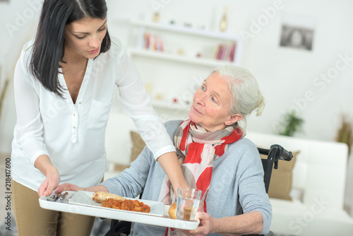 taking the tray from the elderly