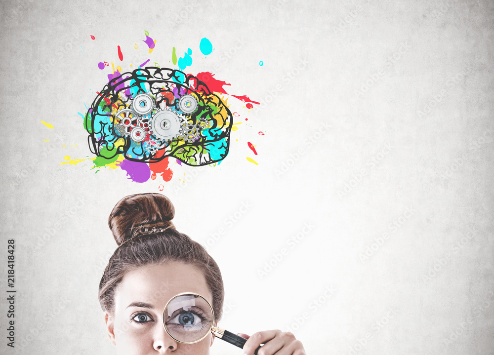 Young woman with magnifying glass, cog brain Young woman with magnifying glass, cog brain