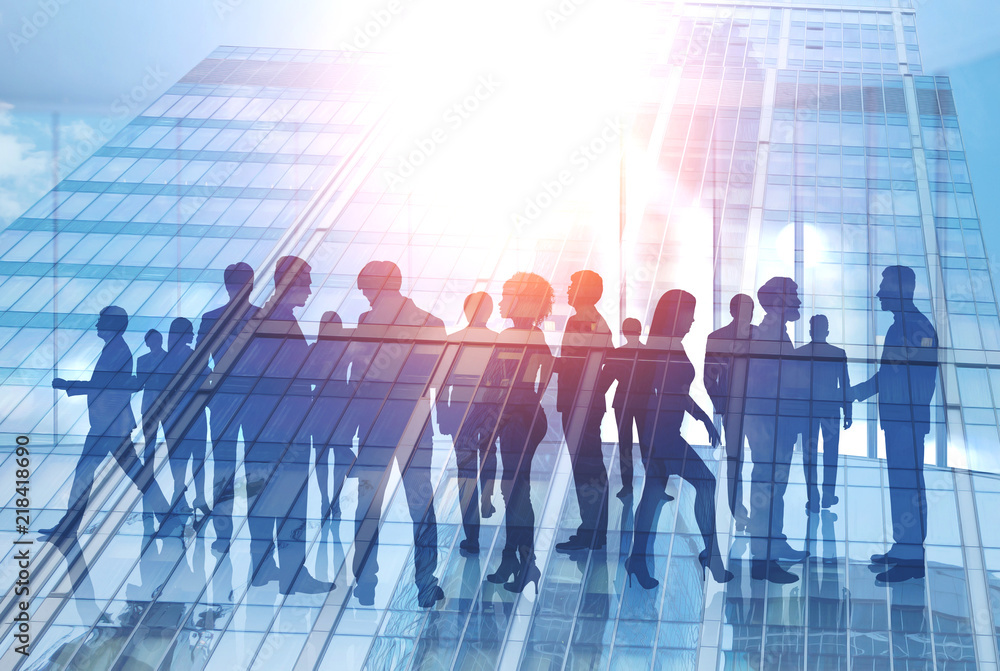 Business people silhouettes in morning city Business people silhouettes in morning city