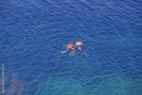 Two men snorkeling in beautiful Adriatic sea, Vis island - Croatia