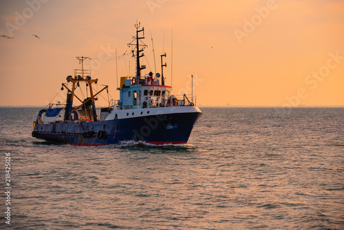 Sunrise and fishing boat © Baronb