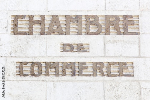 Chamber of commerce sign in French on a wall