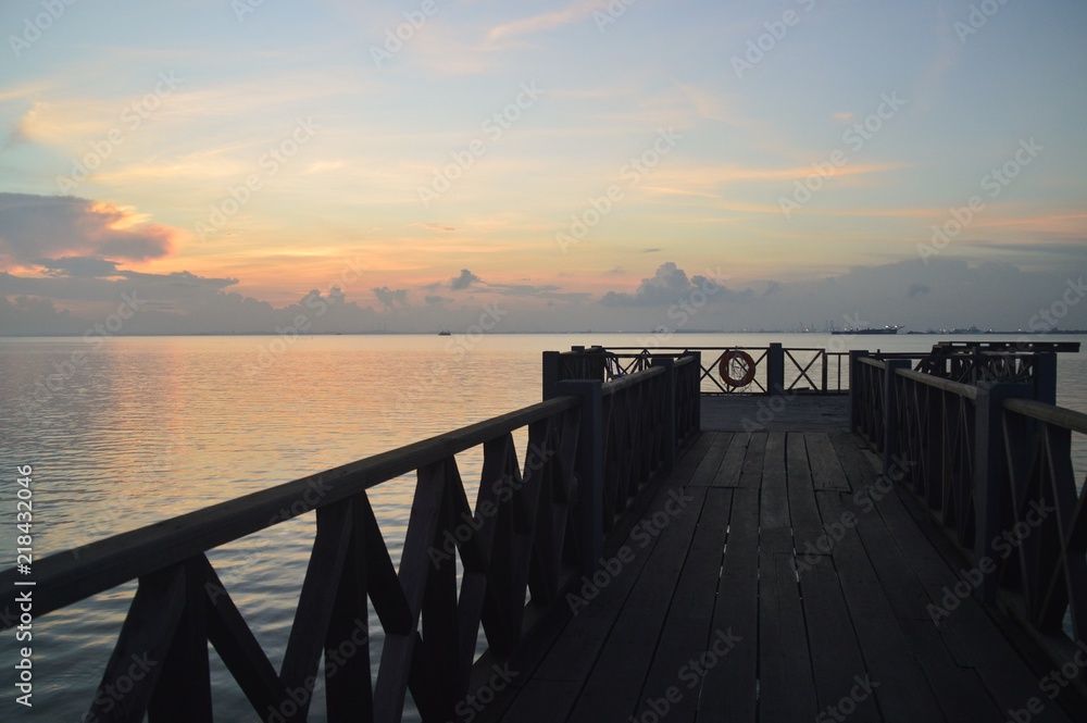 Fototapeta premium a jetty during sunrise