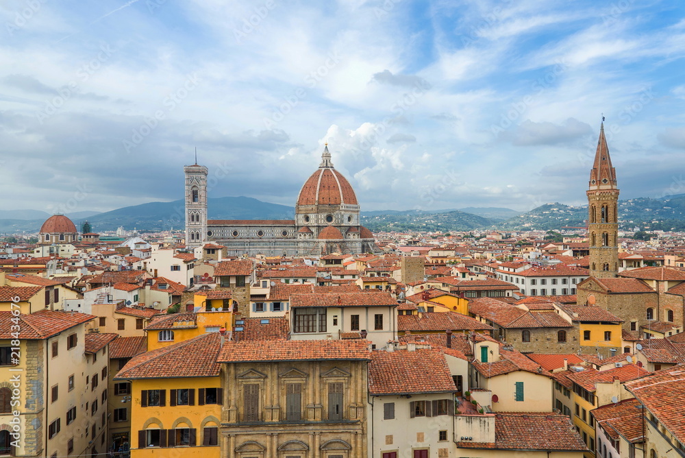 Fototapeta premium Top panoramic cityscape view of Florence, capital of Tuscany region,plenty of roof top renaissance architectures and Piazza del Duomo, Cathedral of Santa Maria del Fiore is major tourist attraction.