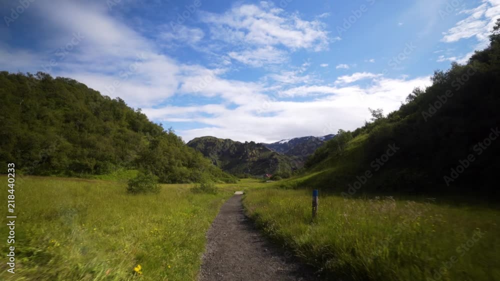 Beautiful sunny summer day in the Icelandic highlands. Steadicam footage moving backwards on the last part of the Laugarvegur trekking trail. Beautiful scenery in Thorsmork. Beautiful sunny summer day in the Icelandic highlands. Steadicam footage moving backwards on the last part of the Laugarvegur trekking trail. Beautiful scenery in Thorsmork.