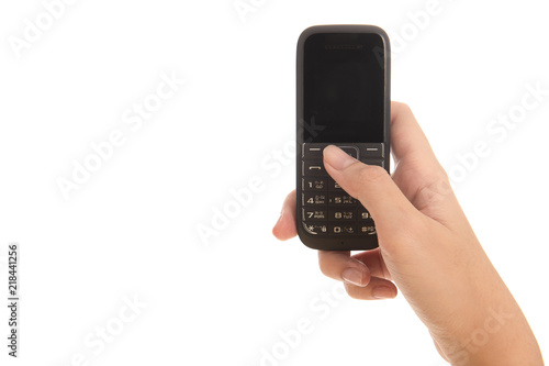 Hand of woman holding old moblie phone isolated on white background. Free from copy space.