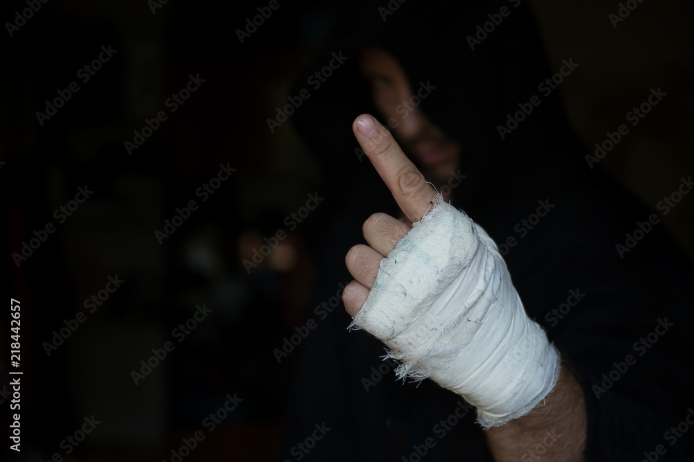 Close-up Of Hand Of Strength Boxer Who Pulls Bandage Before The