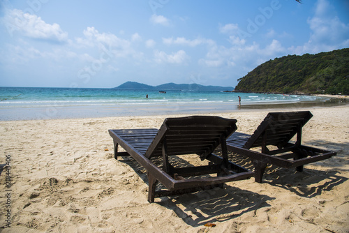 Two beach chairs on the sand beach © Eak Ekkachai