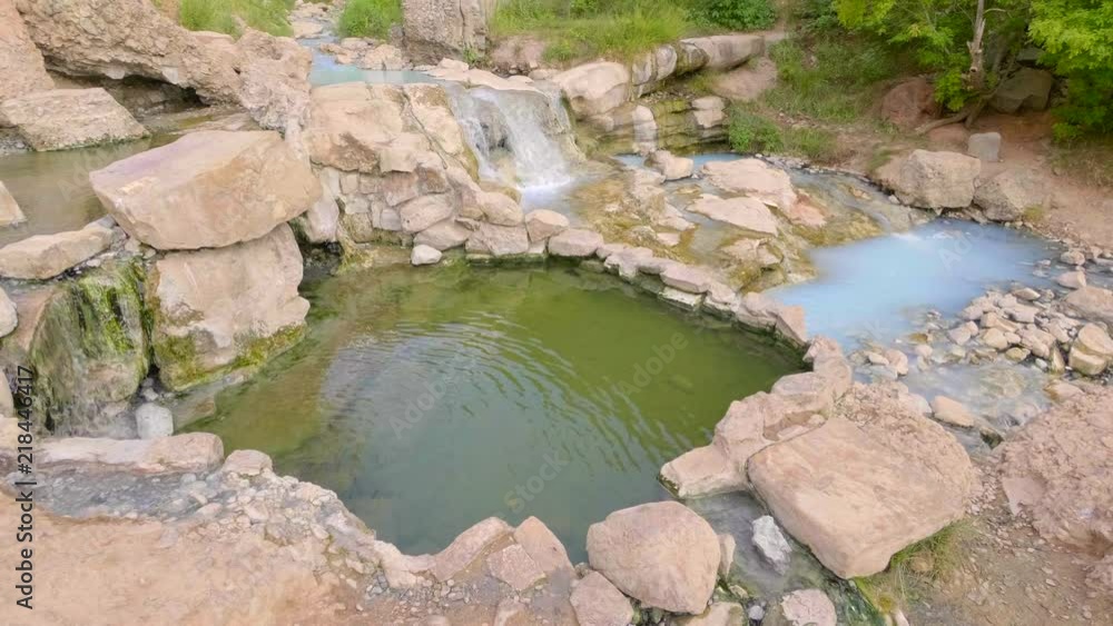 Blue and green hot springs in a beautiful rocky landscape Blue and green hot springs in a beautiful rocky landscape