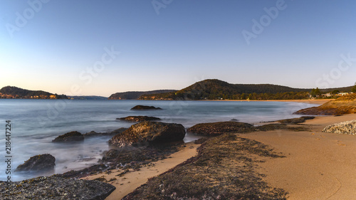 Sunrise Seascape with Rocks and Clear Skies