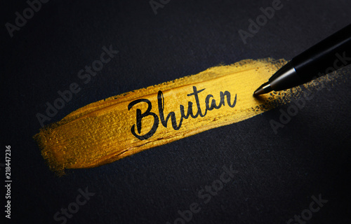 Bhutan Handwriting Text on Golden Paint Brush Stroke