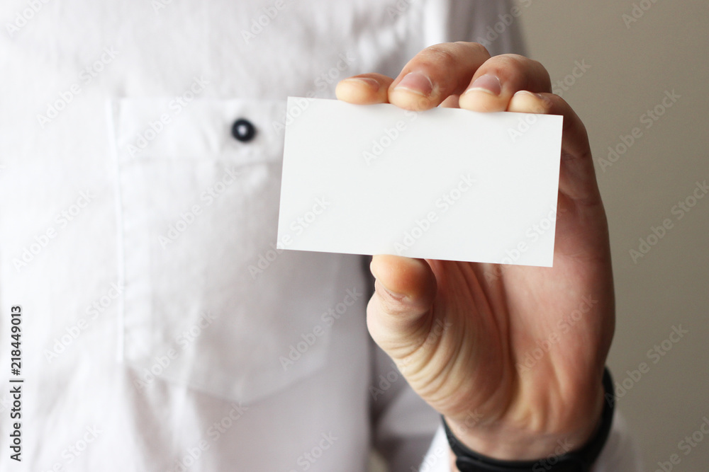 Business card in male hands, business concept. Business card in male hands, business concept.