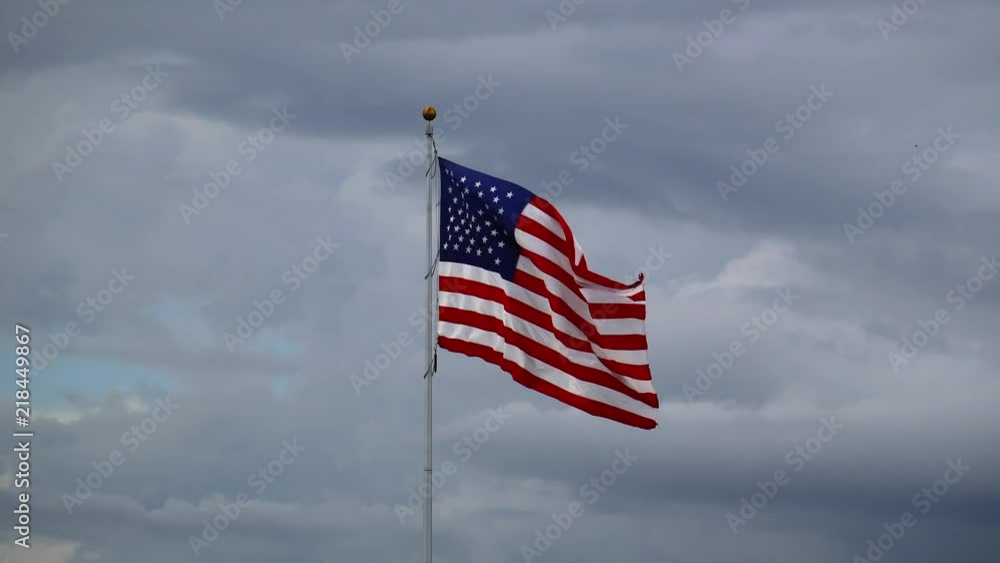 American flag flying in some pretty significant wind on a cloudy day! American flag flying in some pretty significant wind on a cloudy day!