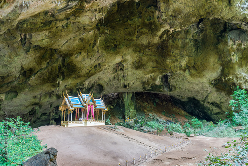 Landscape view of Khuha Kharuehat Throne on mound in hollow place. The tourist attraction at Phraya Nakhon cave in Khao Sam Roi Yot National Park, Prachuap Khiri Khan, Thailand. photo