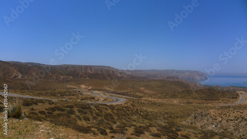 Winding Road and Remote Lake in the Plateau Region