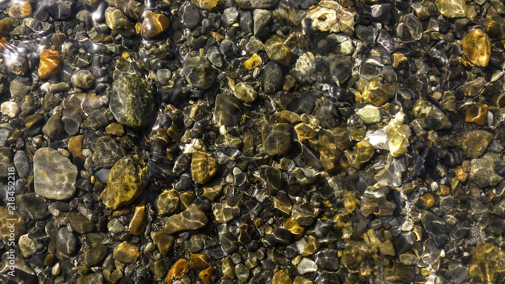 Glossy Stones in a Crystal Clear River Glossy Stones in a Crystal Clear River