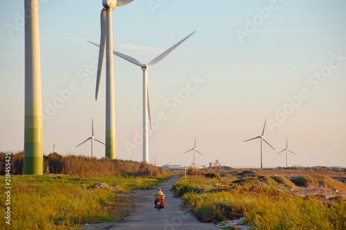 Wind turbines at sunset at a beach in Changhua, Taiwan
