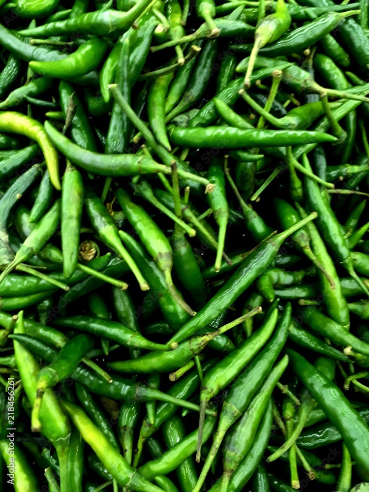 Closeup shot of Green Chill peppers as background Closeup shot of Green Chill peppers as background