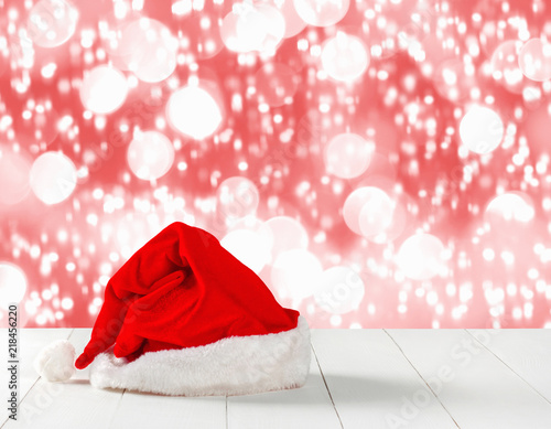 Bright red Santa Claus hat on abstract background