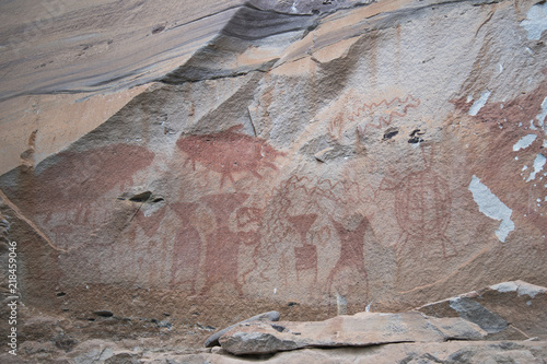 archaeology rock art is human-made markings placed on natural stone, The art is estimated to be 3,000 years old at Pha Taem National Park, Ubon Ratchathani Province, Thailand. photo