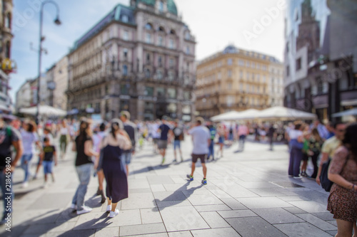 Fototapeta Naklejka Na Ścianę i Meble -  Crowd of anonymous people walking on busy city street, urban city life background