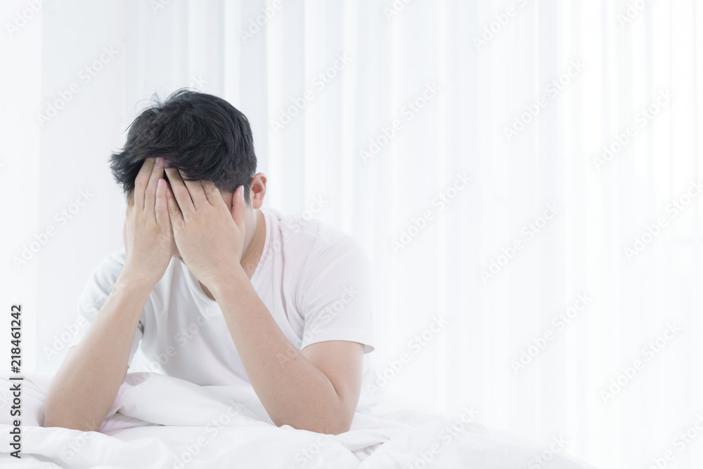 Asian man has wake up with lazying on bed in the morning. Asian man has wake up with lazying on bed in the morning.
