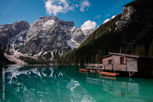 Reflection of the mountain in the water. Amazing view of Braies Lake (Lago di Baraies) in Alps, Italy.