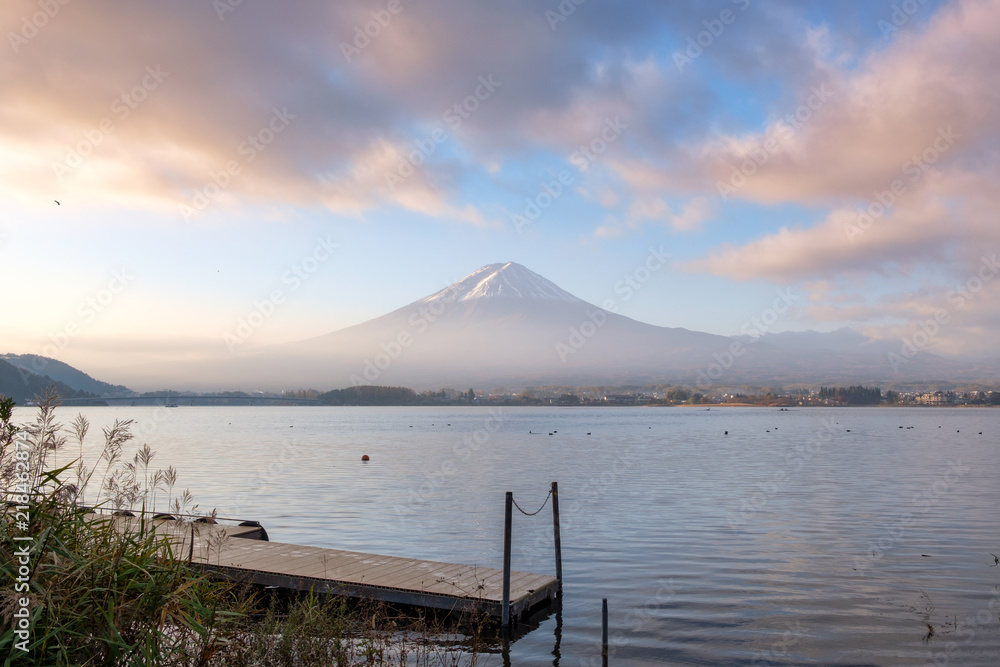 Scenic Mount Fuji and wooden port with colorful sky in Kawaguchiko lake
