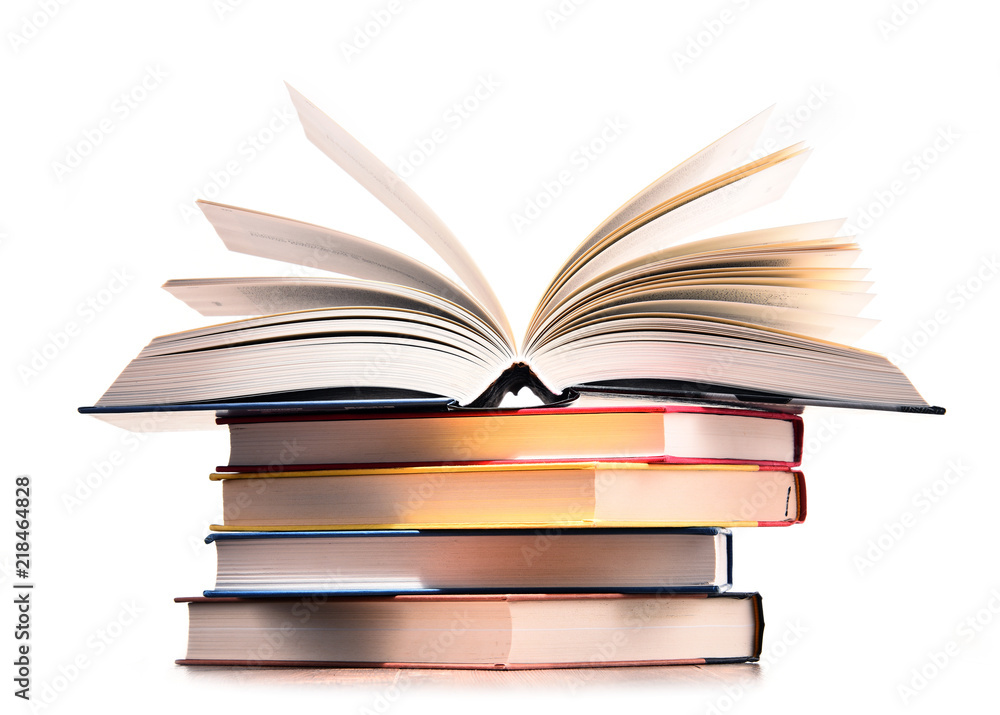 Naklejka premium Composition with stack of books isolated on white