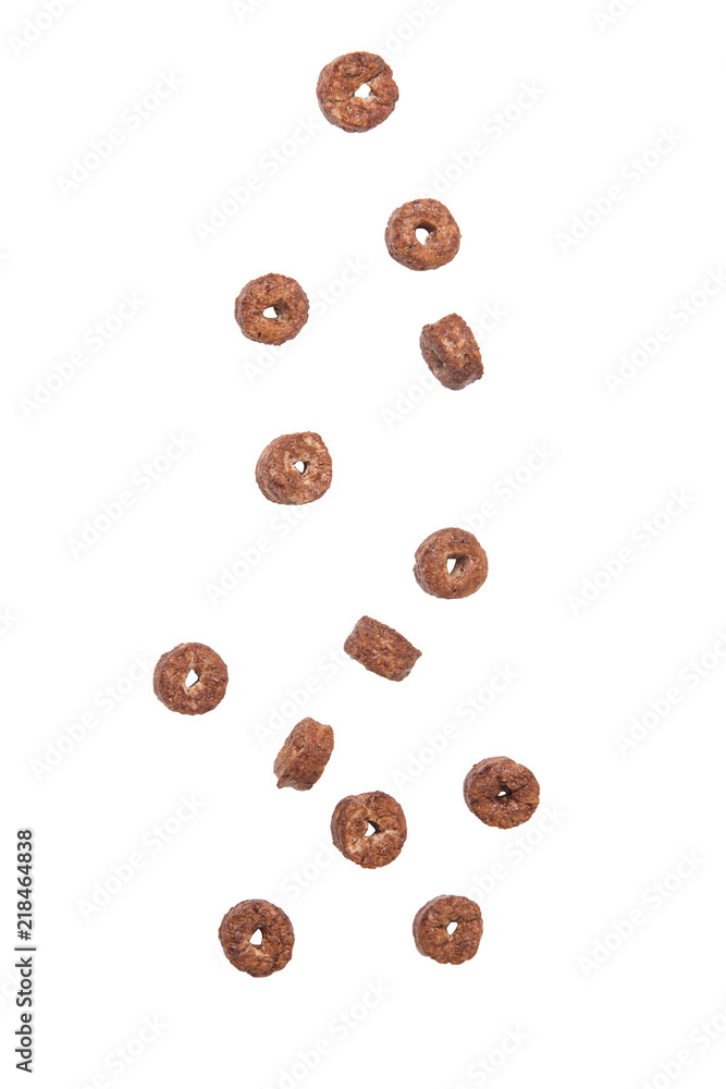 Fototapeta premium Corn flakes chocolate rings falling isolated on white background.