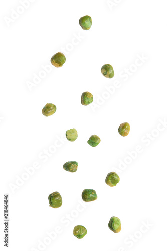 Green peas with salt falling isolated on white background.