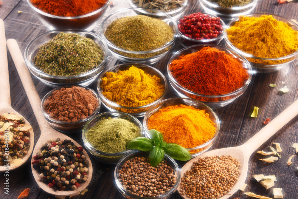 Variety of spices and herbs on kitchen table