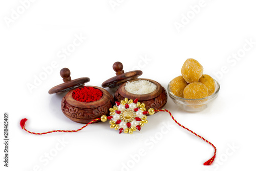 Raksha Bandhan rakhi with flowers diya gift and sweets