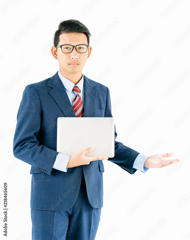 Businessman portrait in suit holding a laptop over white background Businessman portrait in suit holding a laptop over white background