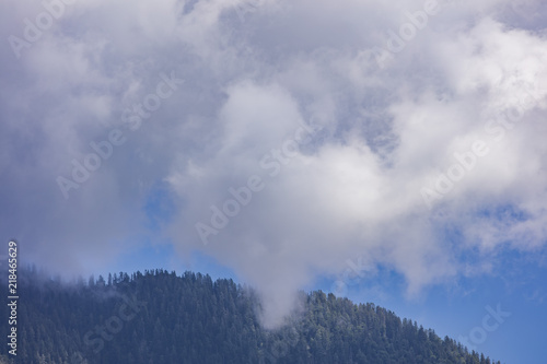white clouds above mountains 