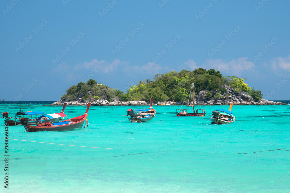 Landscape view of beautiful beach and boat, sea sand sun at Lipe, Sa Toon province in south of Thailand with blue sky,white beach for relax, vacation,long holidays to driving scuba tropical Island Landscape view of beautiful beach and boat, sea sand sun at Lipe, Sa Toon province in south of Thailand with blue sky,white beach for relax, vacation,long holidays to driving scuba tropical Island