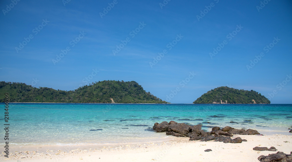 Landscape view of beautiful beach, sea sand sun at Lipe, Sa Toon province in south of Thailand with blue sky and white beach for relax, vacation and your long holidays to driving scuba tropical Island